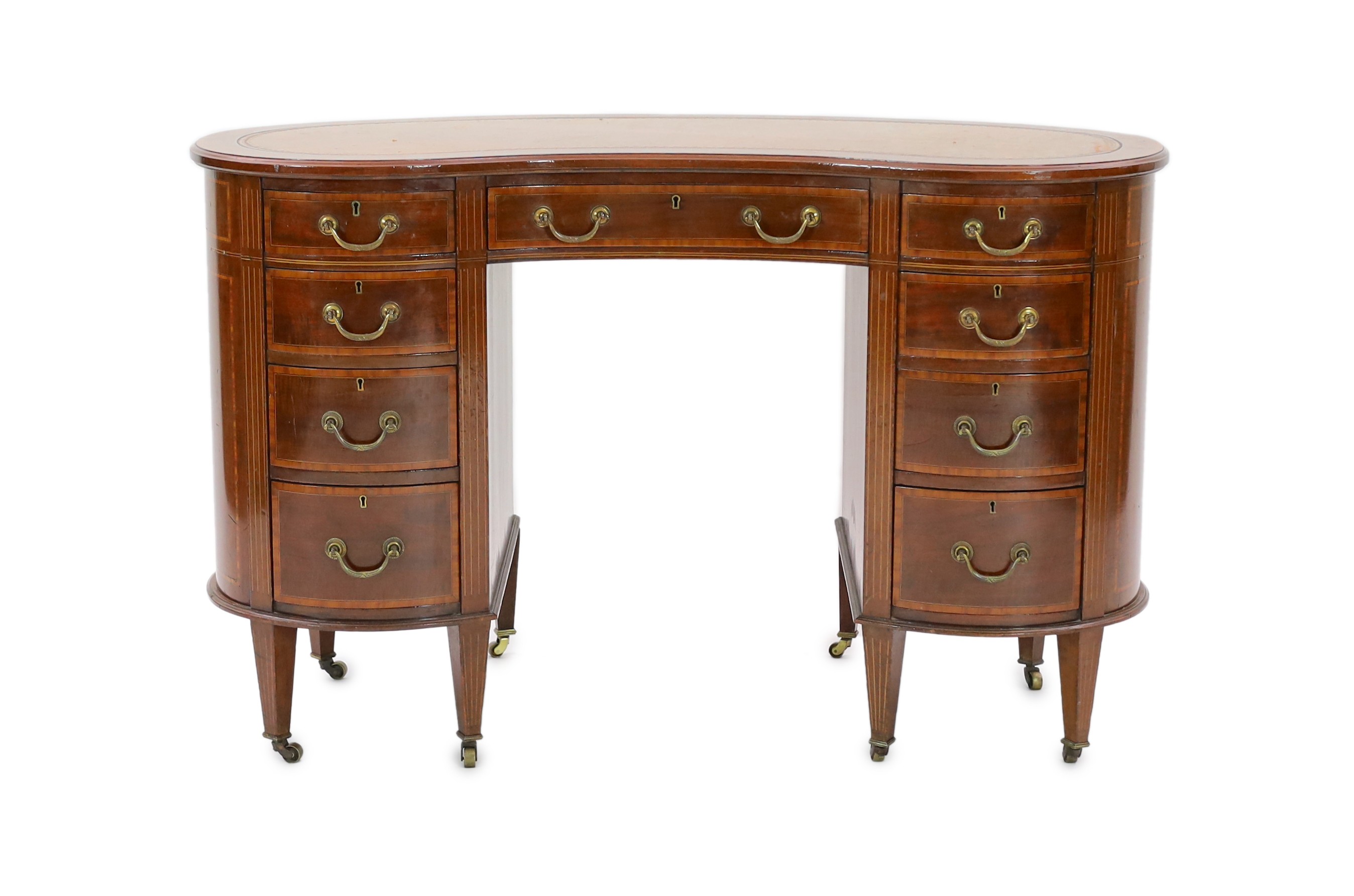 An Edwardian satinwood banded mahogany kidney shaped kneehole desk, with brown skiver and