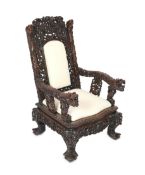 A good Chinese hongmu ‘dragon’ throne armchair, c.1900, carved in high relief and open work with