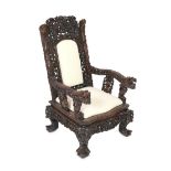 A good Chinese hongmu ‘dragon’ throne armchair, c.1900, carved in high relief and open work with