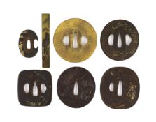 A group of Japanese bronze, iron and mixed metal tsuba and a kozuka knife handle, 19th century,