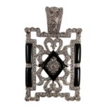 A modern 1920's style pierced 18k white gold, diamond and black onyx set rectangular pendant, the