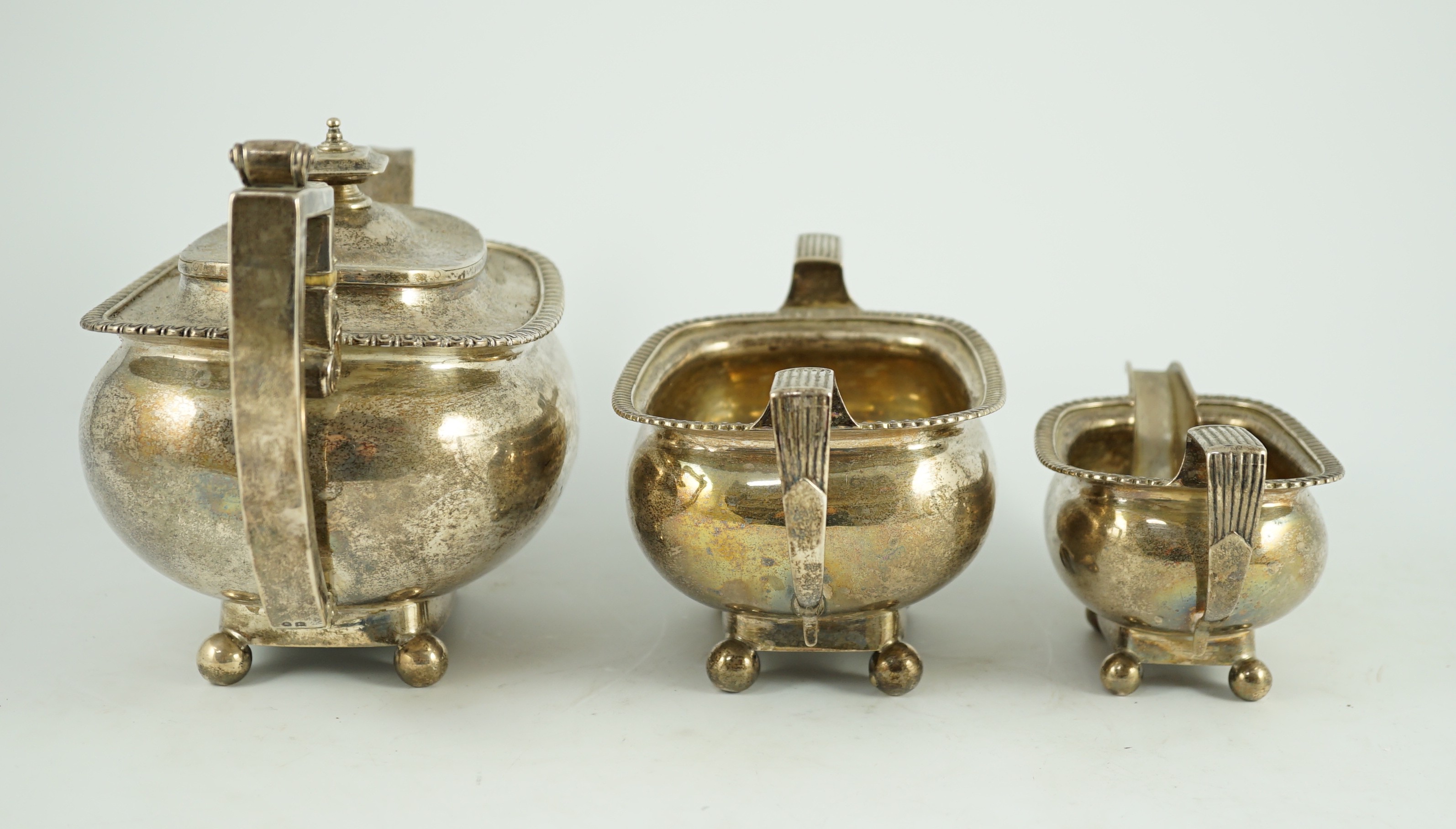 A George III silver three piece 'London' shape tea service, by Samuel Hennell, London, 1811, gross - Image 6 of 7