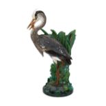 A Minton majolica life-size ‘heron’ stickstand, initialled J.H. for the modeller John Henk, c.