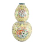 A Chinese yellow ground ‘dragon roundel’ double gourd shaped vase, Qianlong mark, Republic period,