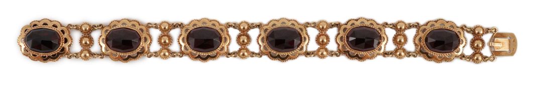 A 20th century Dutch 14k gold and six stone facet cut cabochon garnet set fancy link bracelet, 19cm,