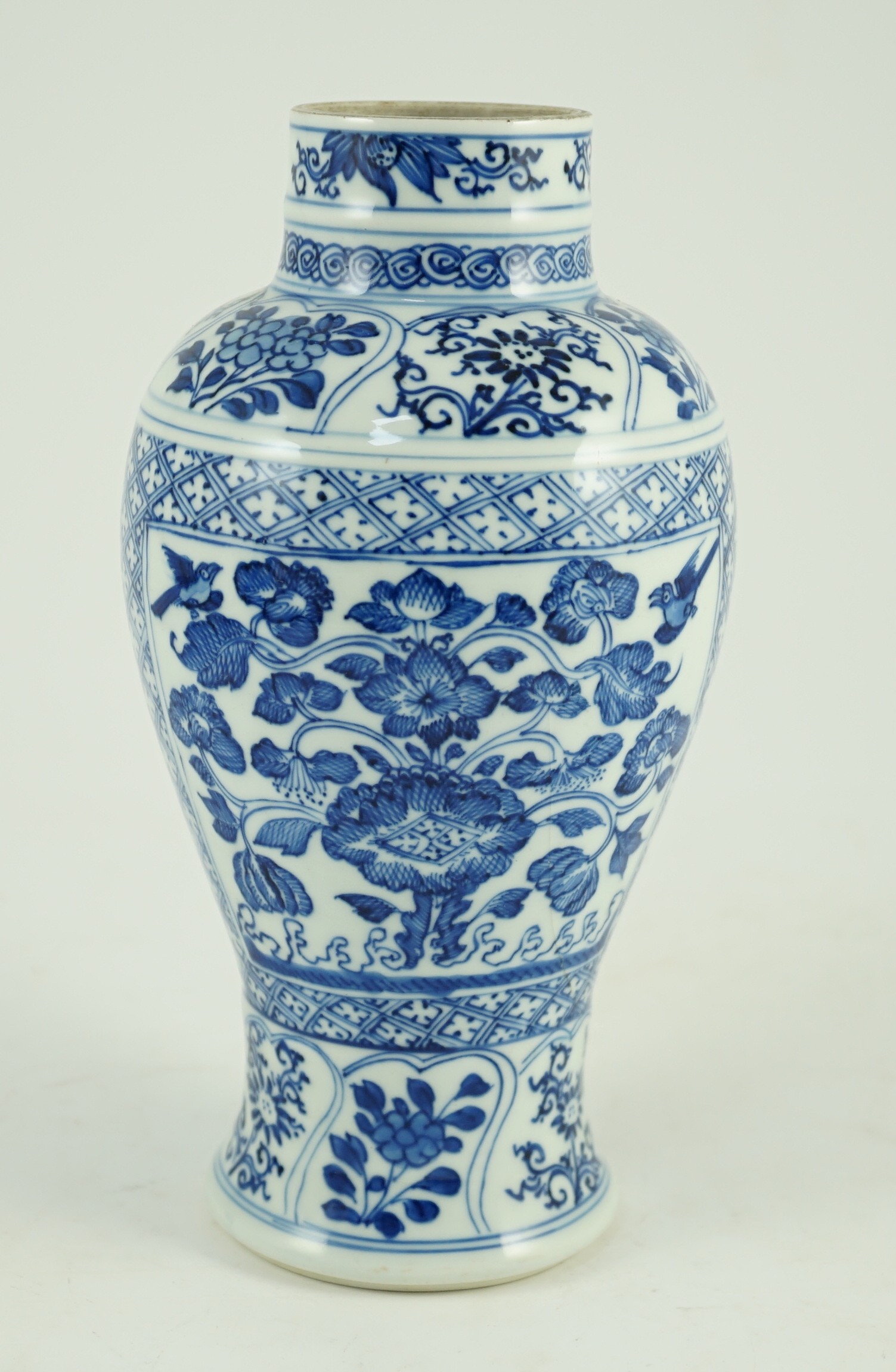 A Chinese blue and white vase, Kangxi period, painted with birds amid flowers and rockwork, within - Image 2 of 9