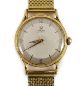 A gentleman's 1950's 18ct gold Omega Automatic wrist watch, with French 18ct gold mark, on an