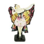 A Doulton & Co. ‘Butterfly’ figure, HN 719, green printed Doulton mark and black enamel inscribed