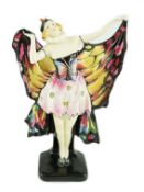A Doulton & Co. ‘Butterfly’ figure, HN 719, green printed Doulton mark and black enamel inscribed