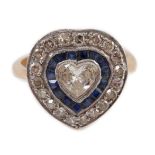 A 1920's, gold and platinum, millegrain set sapphire and diamond cluster set ring, with central