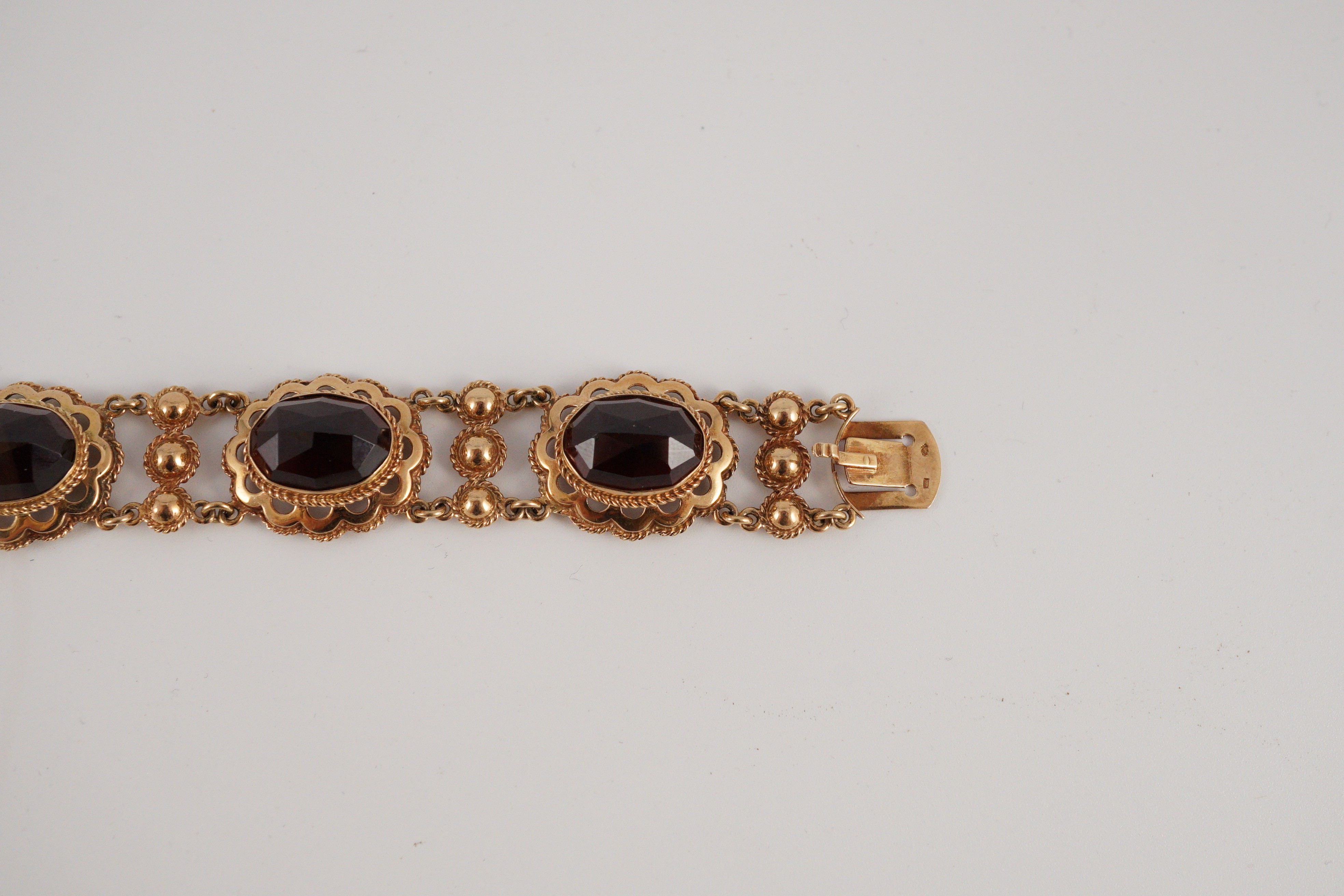 A 20th century Dutch 14k gold and six stone facet cut cabochon garnet set fancy link bracelet, 19cm, - Image 7 of 9