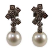 A modern pair of 18ct white gold, single stone South Sea pearl and eight stone diamond cluster set