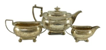A George III silver three piece 'London' shape tea service, by Samuel Hennell, London, 1811, gross
