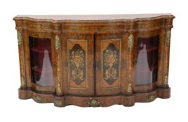 A Victorian marquetry inlaid walnut serpentine front credenza, the two central doors inlaid with