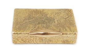 A 1960's 9ct gold Cartier rectangular pill box, with samorodok decoration, signed Cartier, London