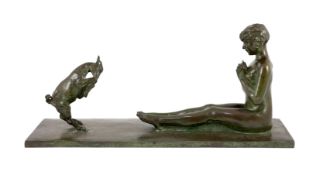 After Paul Silvestre (French, 1884-1976). A patinated Art Deco bronze group of a Bacchante and faun,