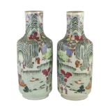 A pair of Chinese famille rose fencai inscribed vases, mid 19th century, each well painted with