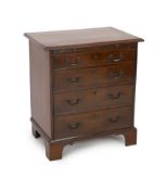 A small George III mahogany chest, with brushing slide and four graduated long drawers on bracket