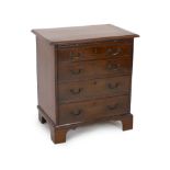 A small George III mahogany chest, with brushing slide and four graduated long drawers on bracket