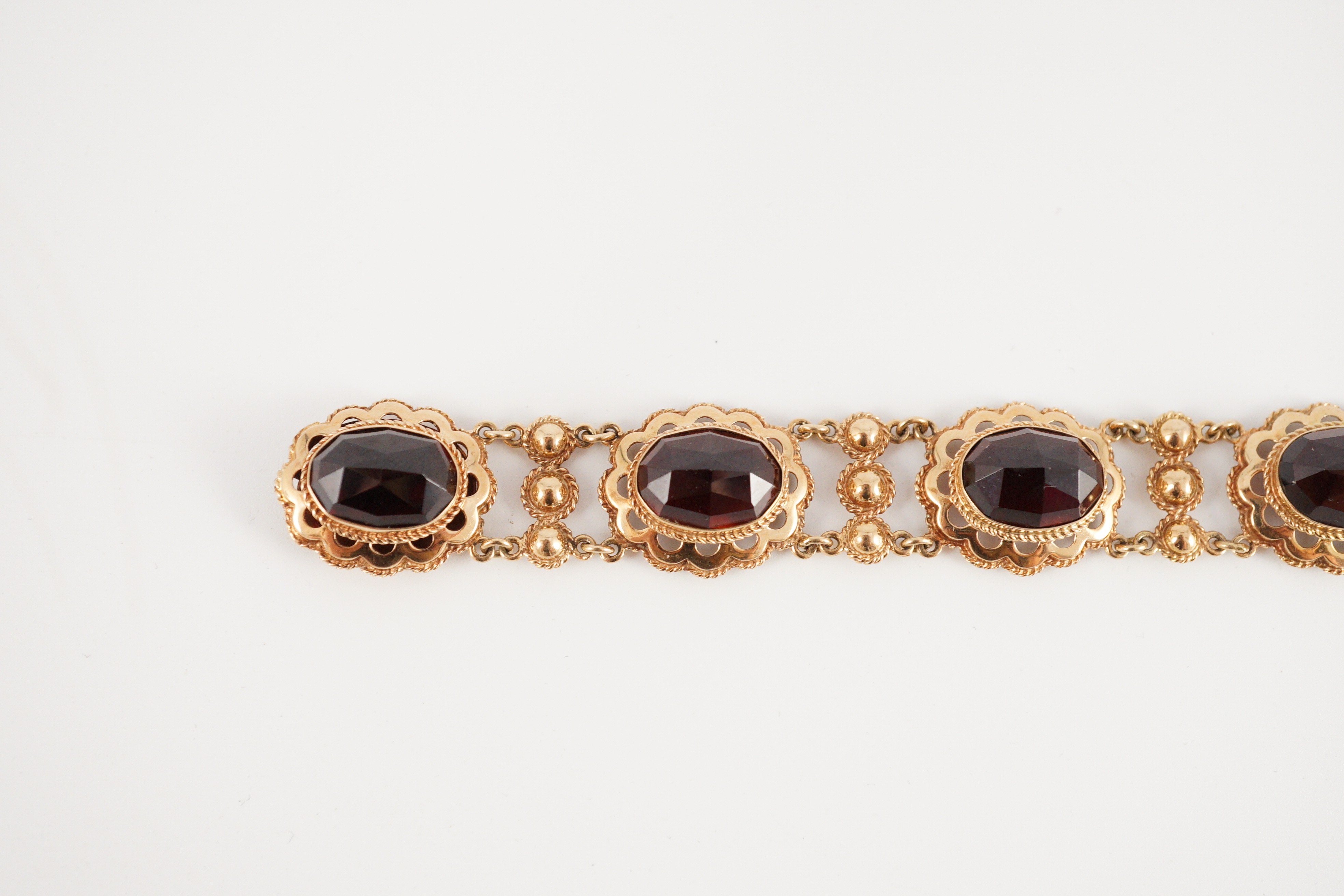A 20th century Dutch 14k gold and six stone facet cut cabochon garnet set fancy link bracelet, 19cm, - Image 5 of 9
