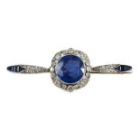 An early 20th century French platinum, sapphire and diamond bar brooch, the central round cut