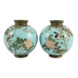 A pair of Japanese silver and copper wire cloisonné enamel vases, Meiji period, each of globular