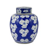 A Chinese blue and white prunus jar and cover, 19th century, of ovoid form, double circle mark to