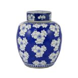 A Chinese blue and white prunus jar and cover, 19th century, of ovoid form, double circle mark to