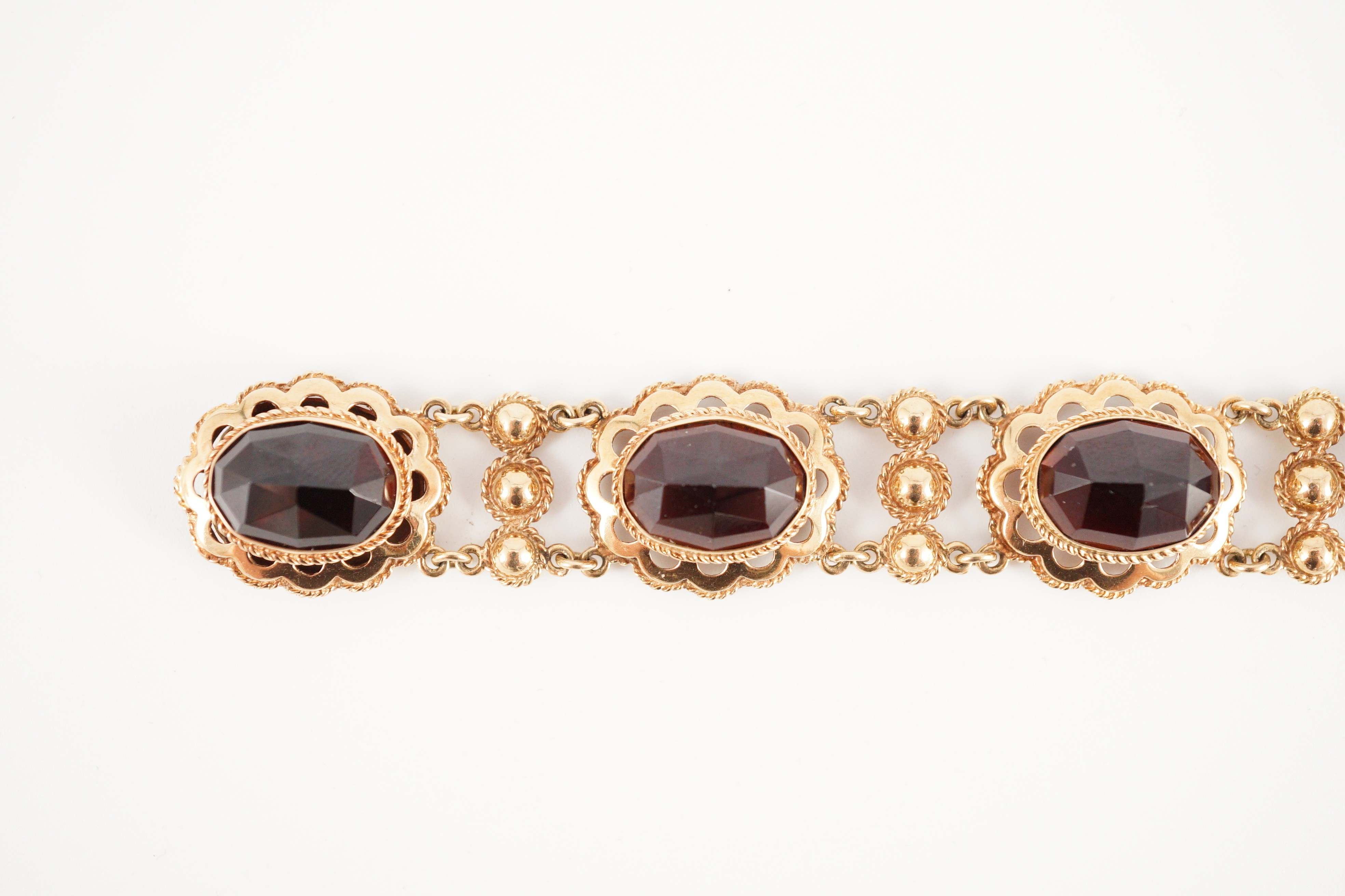 A 20th century Dutch 14k gold and six stone facet cut cabochon garnet set fancy link bracelet, 19cm, - Image 4 of 9