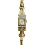 A lady's 1950's gold, ruby and diamond set manual wind rectangular dial cocktail watch, with