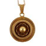 A Victorian gold circular pendant, with flower head centre and glazed back, on a later 9ct gold