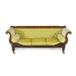 A Regency rosewood settee, with acanthus carved cresting rail, brass paterae inset scroll arms and