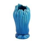 A Chinese turquoise glazed ‘finger citron’ vase, 18th century, unglazed biscuit base, 22cm high,