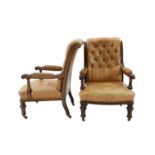 A pair of early Victorian mahogany open armchairs, with moulded frames and brown leather upholstery,