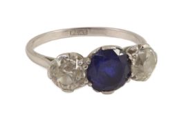 A platinum two stone diamond and single stone sapphire ring, the total diamond weight
