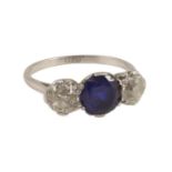A platinum two stone diamond and single stone sapphire ring, the total diamond weight