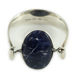 A Vivianna Torun for Georg Jensen sterling silver and oval cabochon lapis lazuli set bangle,