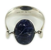 A Vivianna Torun for Georg Jensen sterling silver and oval cabochon lapis lazuli set bangle,