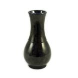 A small Chinese aubergine glazed vase, 18th century, of baluster form, unglazed base, 16.4cm high**