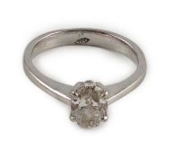 A modern platinum and solitaire oval cut diamond set ring, with a G.H. Pressley & Son insurance