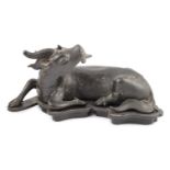 A Chinese bronze figure of a recumbent qilin, late Ming dynasty, Campbell collection label to