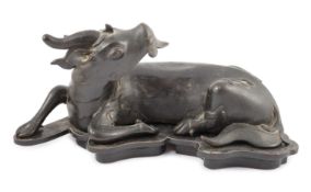 A Chinese bronze figure of a recumbent qilin, late Ming dynasty, Campbell collection label to