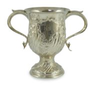 A George III silver baluster two handled pedestal cup, with later embossed decoration, by John