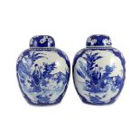 A pair of large Chinese blue and white jars and covers, 19th century, painted to each side with a