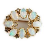 An Edwardian gold, eight stone oval opal set oval brooch, with diamond chip spacers, 20mm, gross