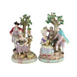 A pair of Meissen groups of apple pickers and flower gatherers, 19th century, blue crossed swords