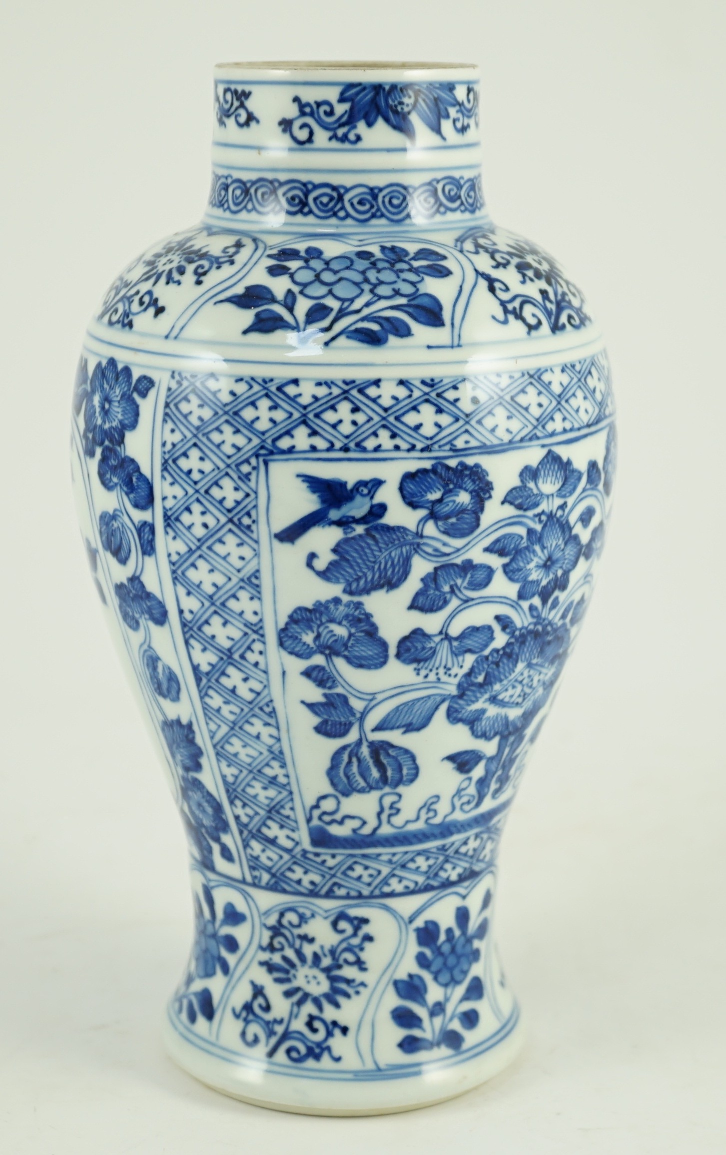 A Chinese blue and white vase, Kangxi period, painted with birds amid flowers and rockwork, within - Image 3 of 9