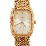 A gentleman's 1980's 18ct gold Longines Flagship manual wind tonneau shaped dress wrist watch,