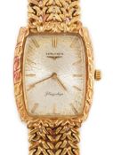 A gentleman's 1980's 18ct gold Longines Flagship manual wind tonneau shaped dress wrist watch,