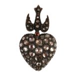 A Victorian style gold and graduated rose cut diamond set heart shaped pendant, with diamond and